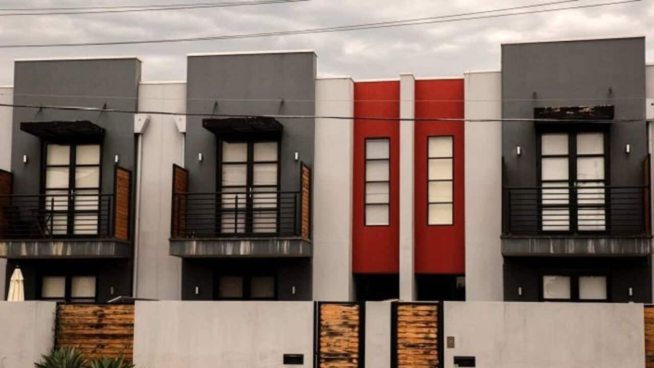 Modern box-like townhouses have been popping up across Australian cities and suburbs (ABC News Malcolm Sutton)