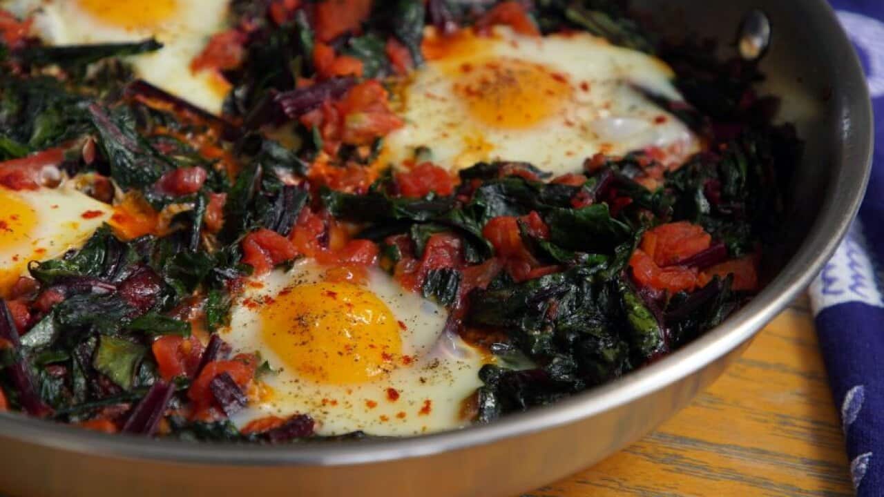 Eggs in a hole, cooked in greens