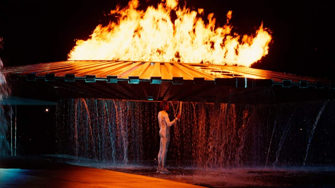 Cathy Freeman lighting the Olympic cauldron in 2000