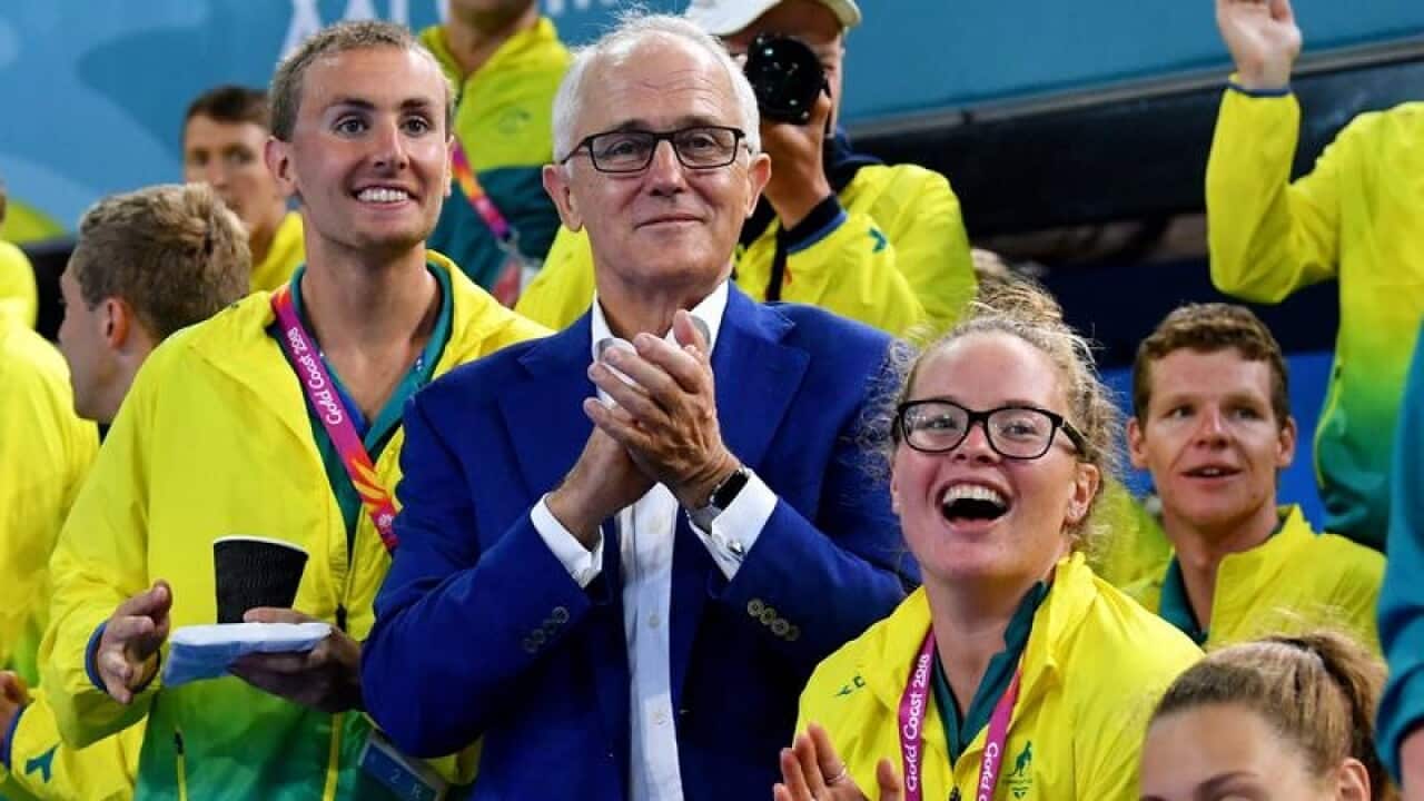 Malcolm Turnbull was seen fumbling the lyrics to John Farnham's 'The Voice' at the Commonwealth Games.