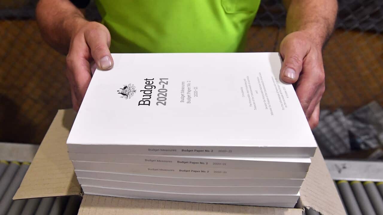 The 2020-2021 Budget Papers are seen at a printing facility prior to being delivered to Parliament House in Canberra, Sunday, October 4, 2020. (AAP Image/Mick Tsikas) NO ARCHIVING