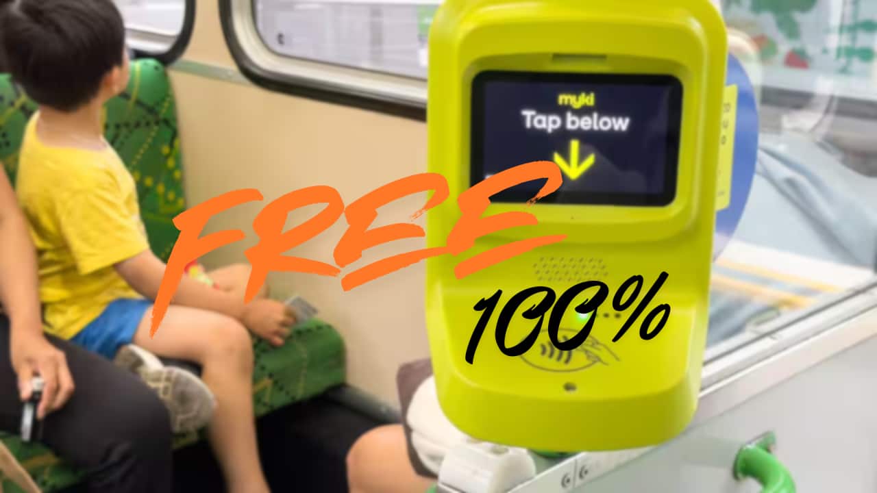 A Myki card reader with a child sitting on a seat behind.