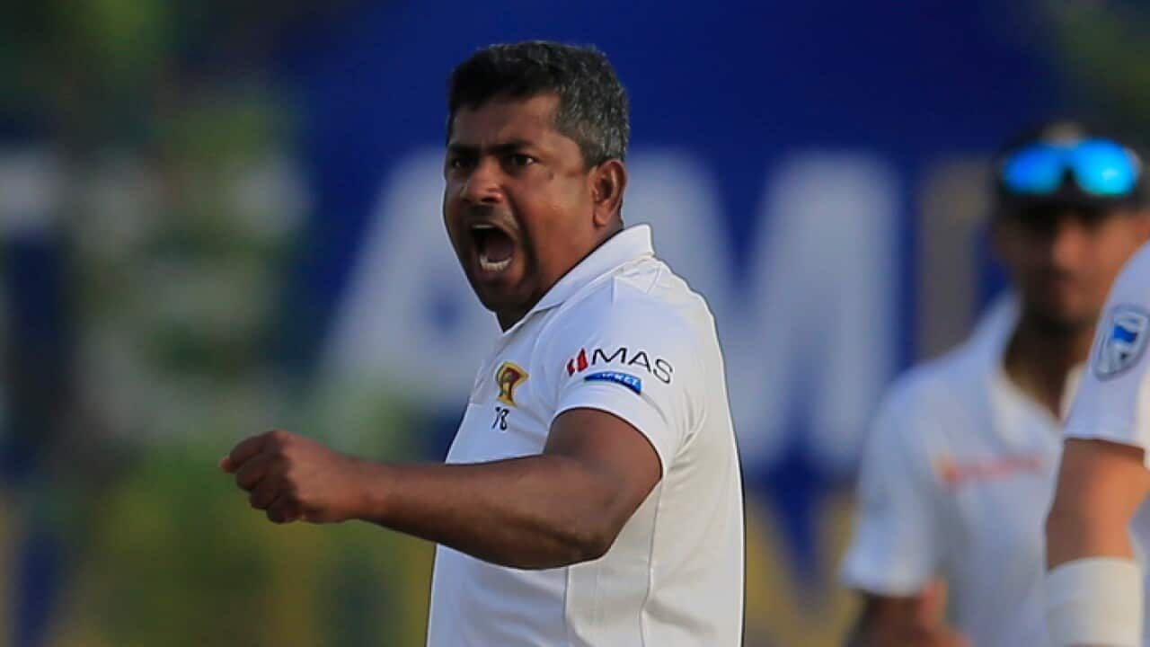 Sri Lanka's Rangana Herath celebrates the dismissal of South Africa's Aiden Markram during the first day's play of their first test cricket match in Galle, Sri Lanka, Thursday, July 12, 2018. (AP Photo/Eranga Jayawardena)