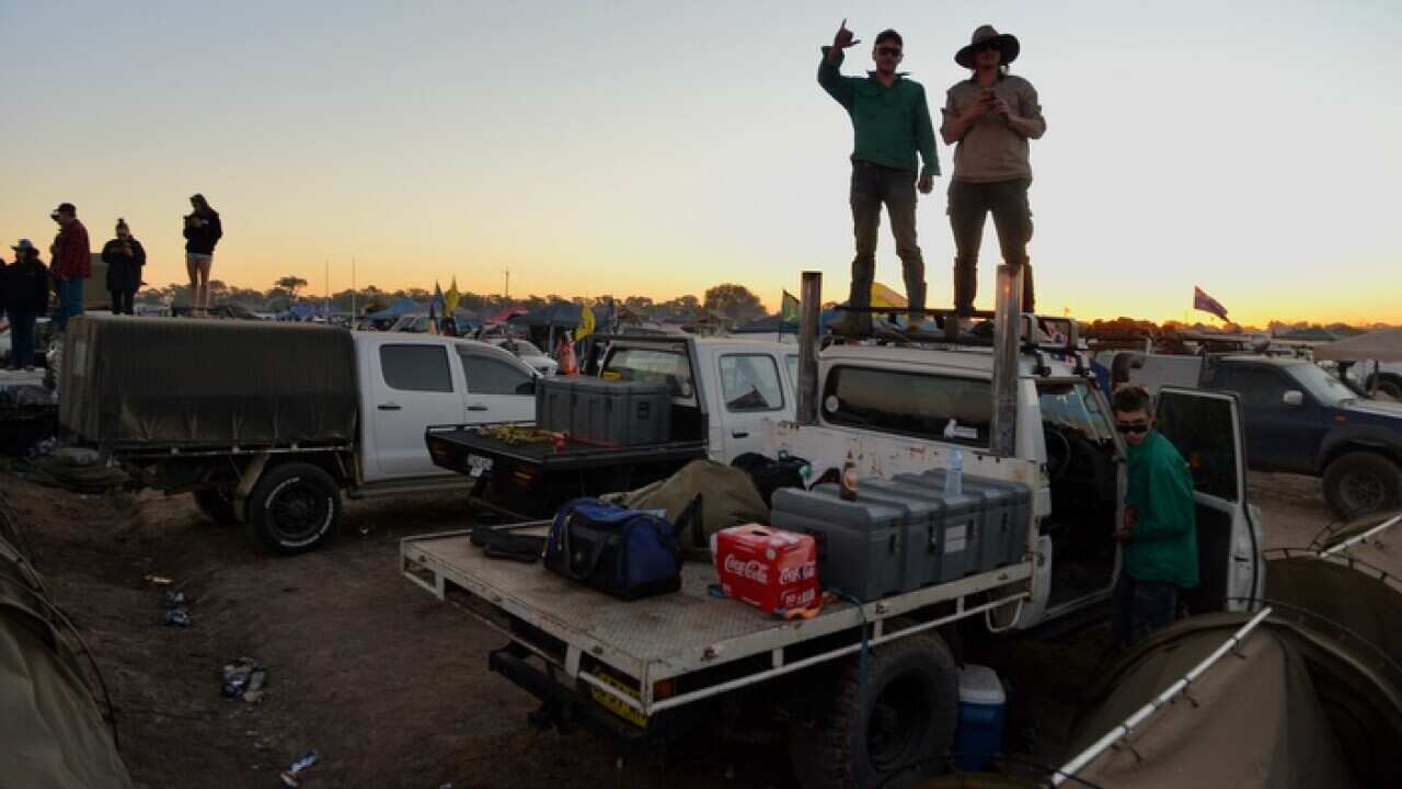 Revellers are seen during the annual Ute Muster celebration in the small NSW town of Deniliquin, on Saturday, September 29, 2018. The Deniliquin Ute Muster celebrates all things Australian and the icon of the Ute. (AAP Image/Perry Duffin) NO ARCHIVING