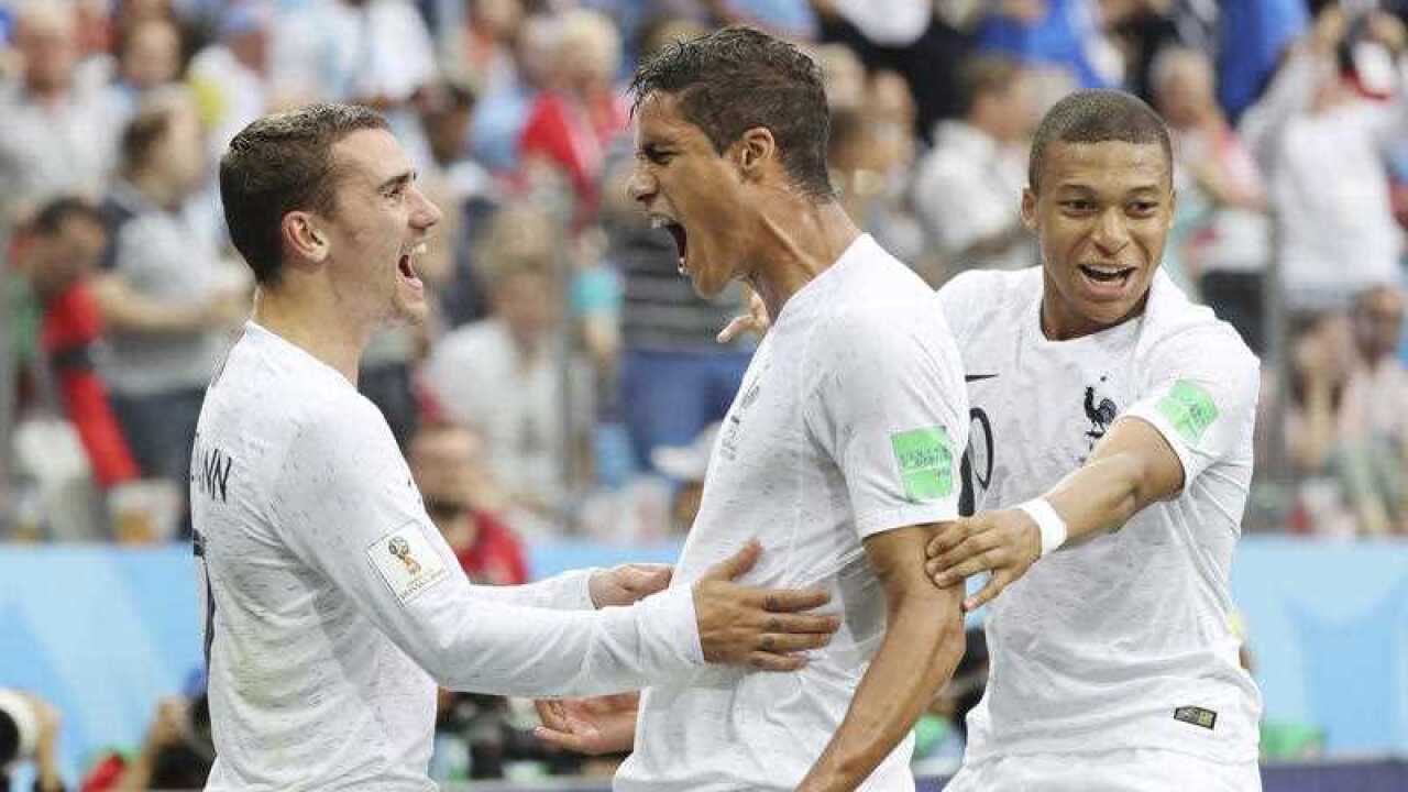 Raphael VARANE of France (C, 4) celebrates after scoring an opener by head in the first half during the match of the quarter-finals in FIFA World Cup.