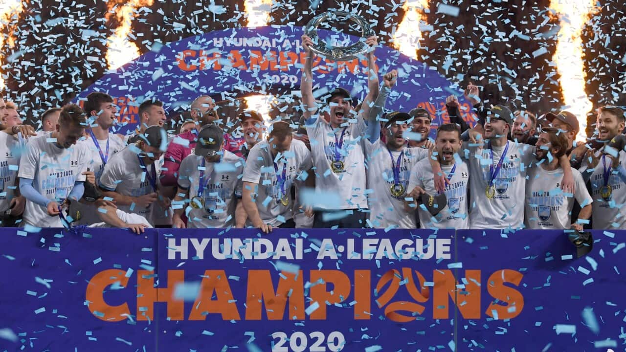 Sydney FC celebrate after receiving the A-League Championship Trophy following their win over Melbourne City the A-League Grand Final match between Sydney FC and Melbourne City at Bankwest Stadium in Sydney, Sunday, August 30, 2020.