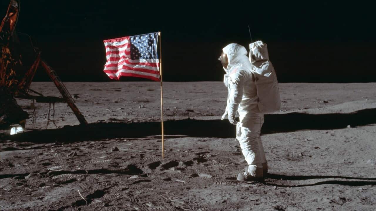 In this July 20, 1969 photo made available by NASA, astronaut Buzz Aldrin Jr. poses for a photograph beside the U.S. flag on the moon 