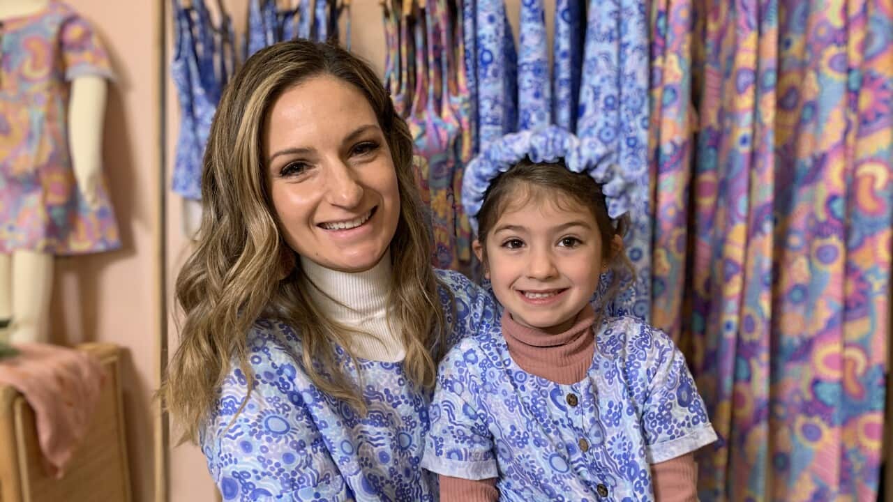 Designer Corina Muir sitting with her daughter, Sapphire.