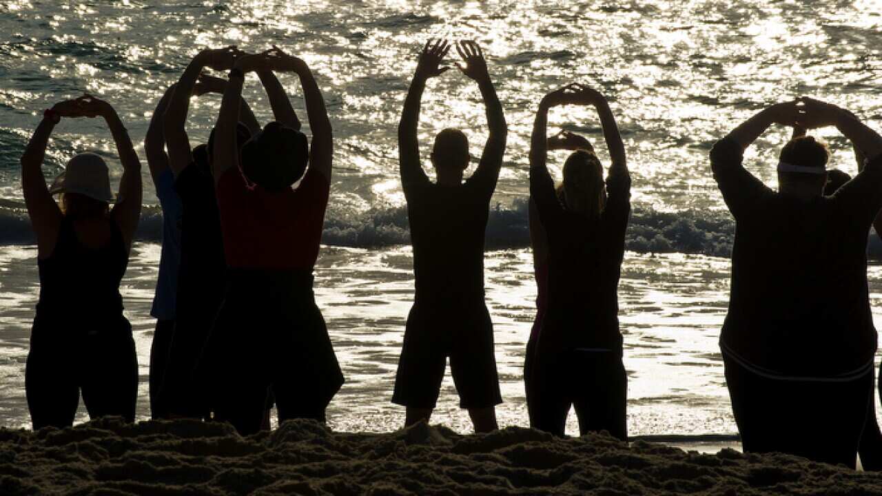 A Tai Chi exercise session at Currumbin Beach on the Gold Coast