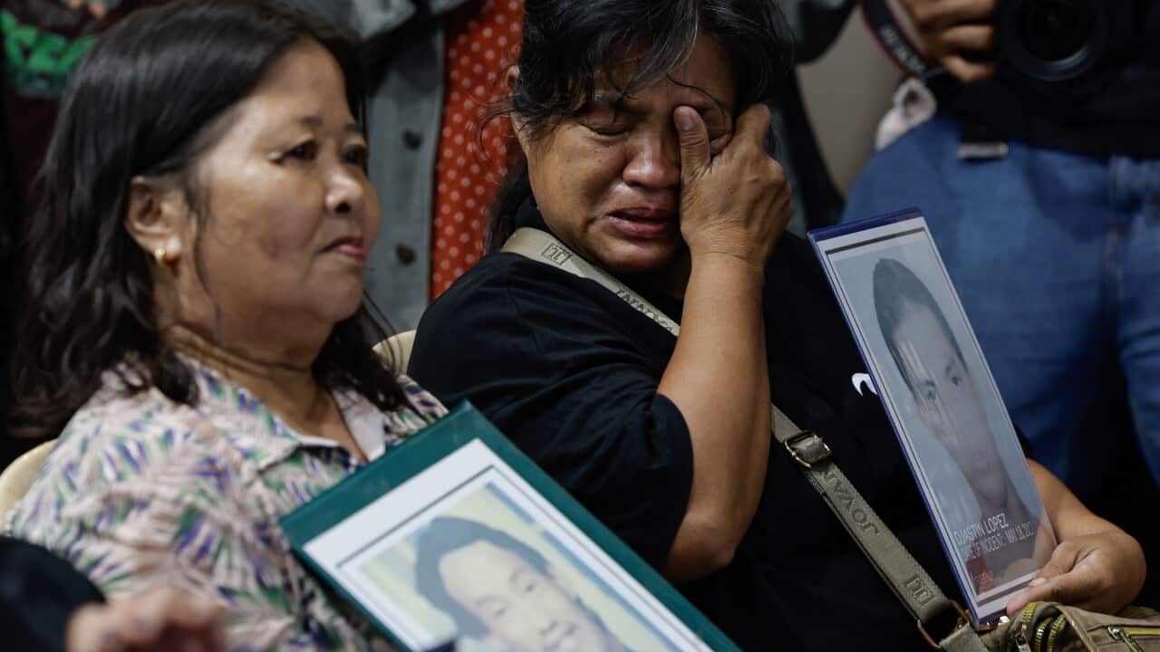 Normita Lopez (R), mother of a victim of alleged extra-judicial killing, cries during a live viewing of an International Criminal Court (ICC) hearing in The Netherlands, in Quezon City, Metro Manila, Philippines, 14 March 2025.