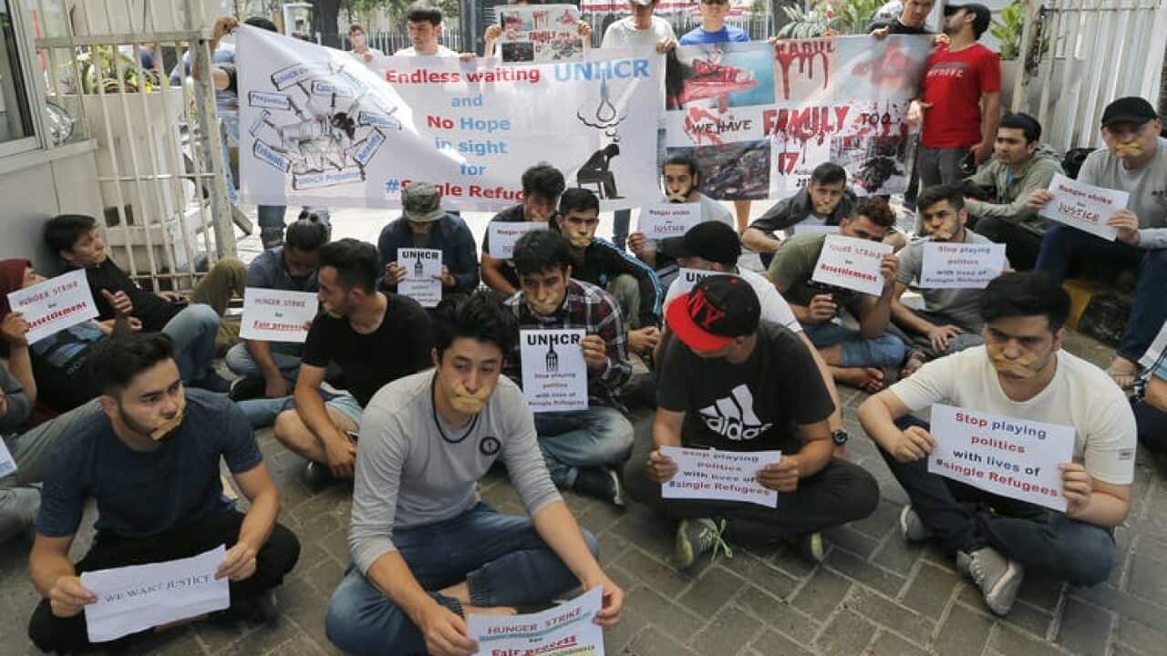 Refugees stage a protest outside the UNHCR representative office in Indonesia in 2019 against Australia’s freeze on resettlement out of the country.