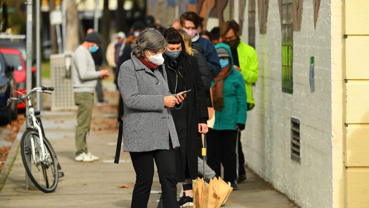 People are seen waiting in a line to receive covid19 tests at a walk-in covid19 testing facility in Melbourne, Wednesday, May 26.