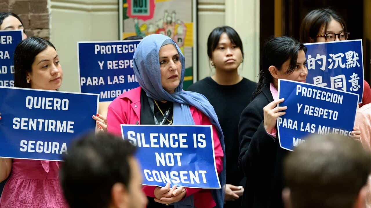Workers hold up placards during a Unions NSW event in Sydney (AAP)
