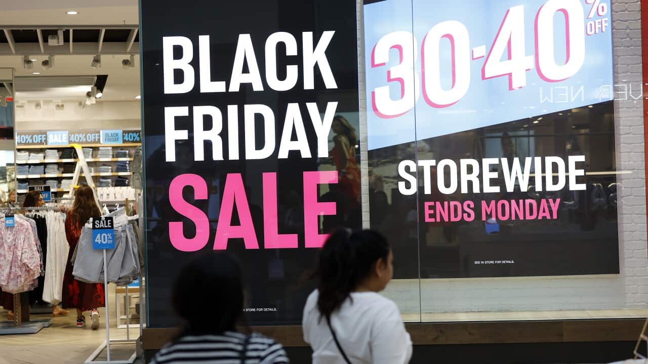 A sign out the front of a store that says "Black Friday Sale" in big letters.