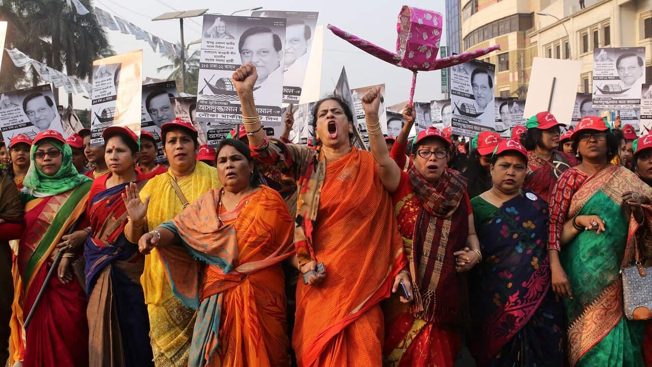 Supporters of the Awami League take part in an election campaign rally.