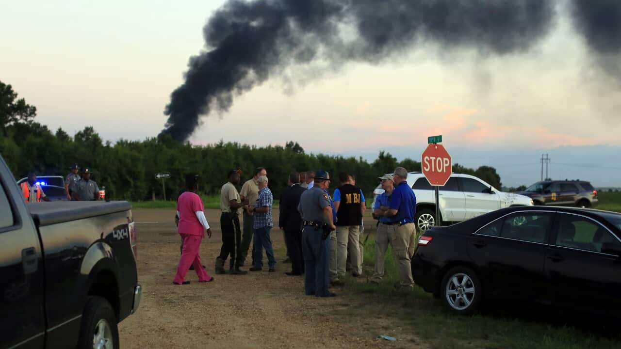 Emergency officials respond to the site of a military plane crash in Leflore County, Mississippi.