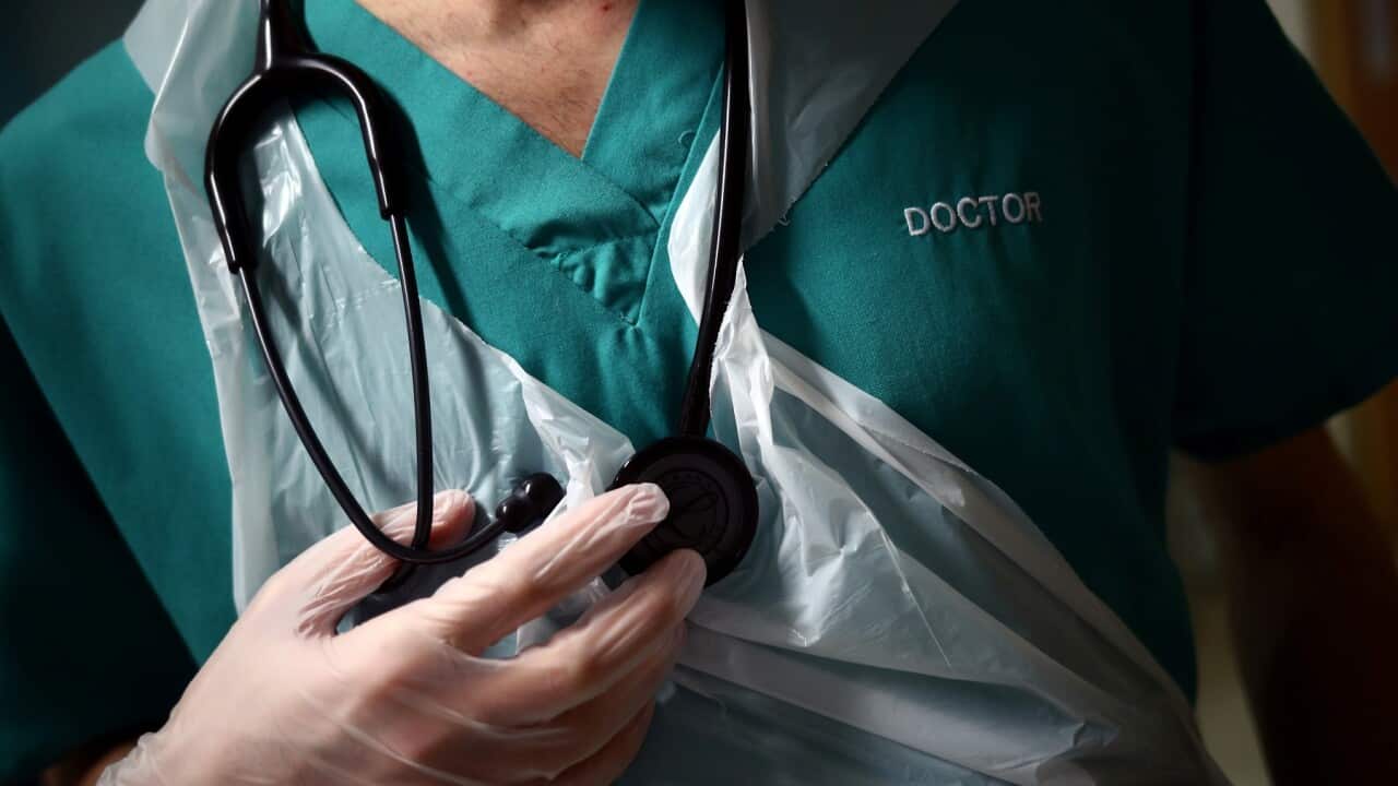 A doctor holding his stethoscope