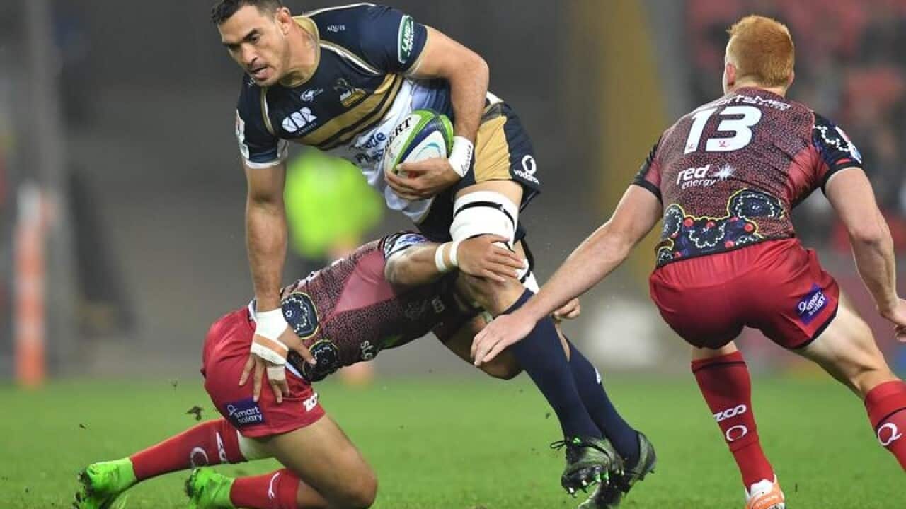 File image of Rory Arnold of the Brumbies being tackled during a game.