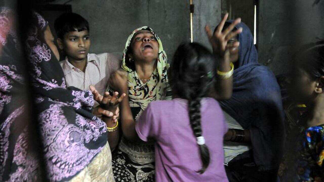 Distraught family of the girl who was raped and set afire.