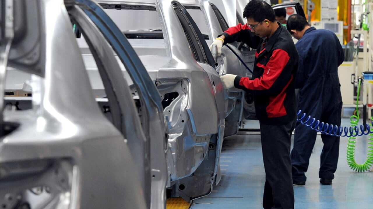 File photo of workers building cars at the Toyota plant in Melbourne