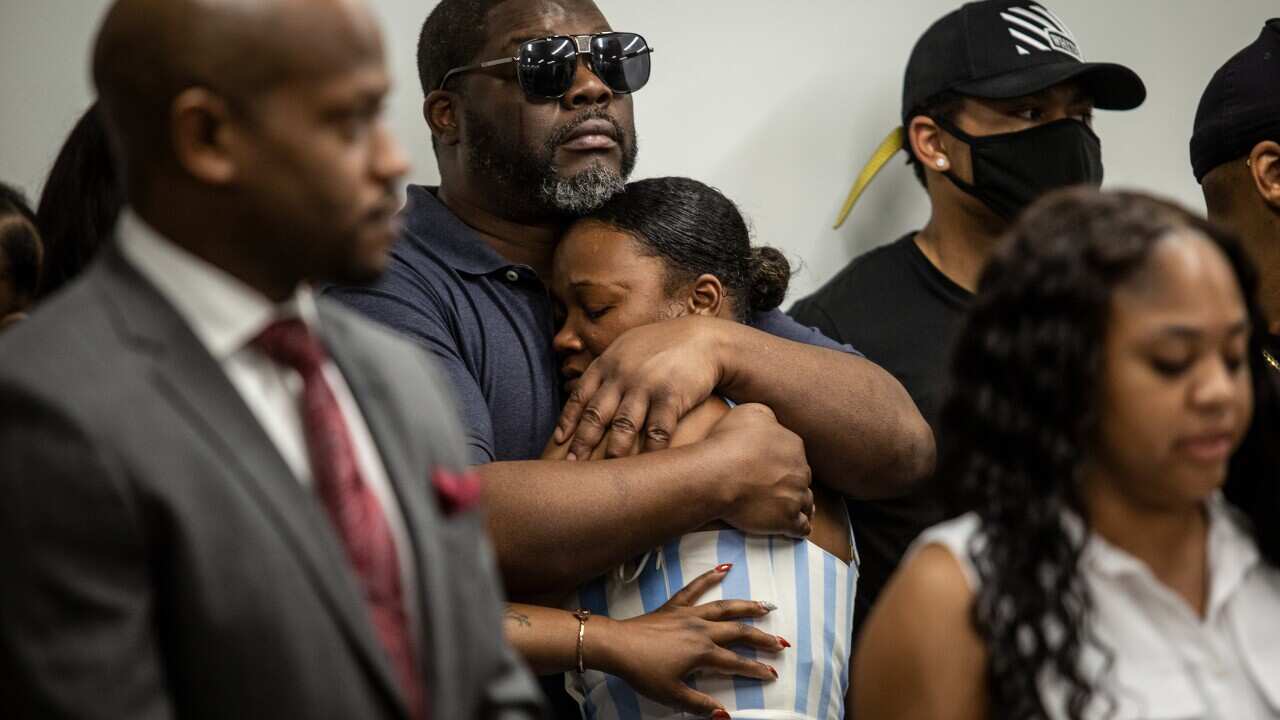 Family members of Rayshard Brooks are seen at a news conference on 15 June, 2020, in Atlanta, Georgia.