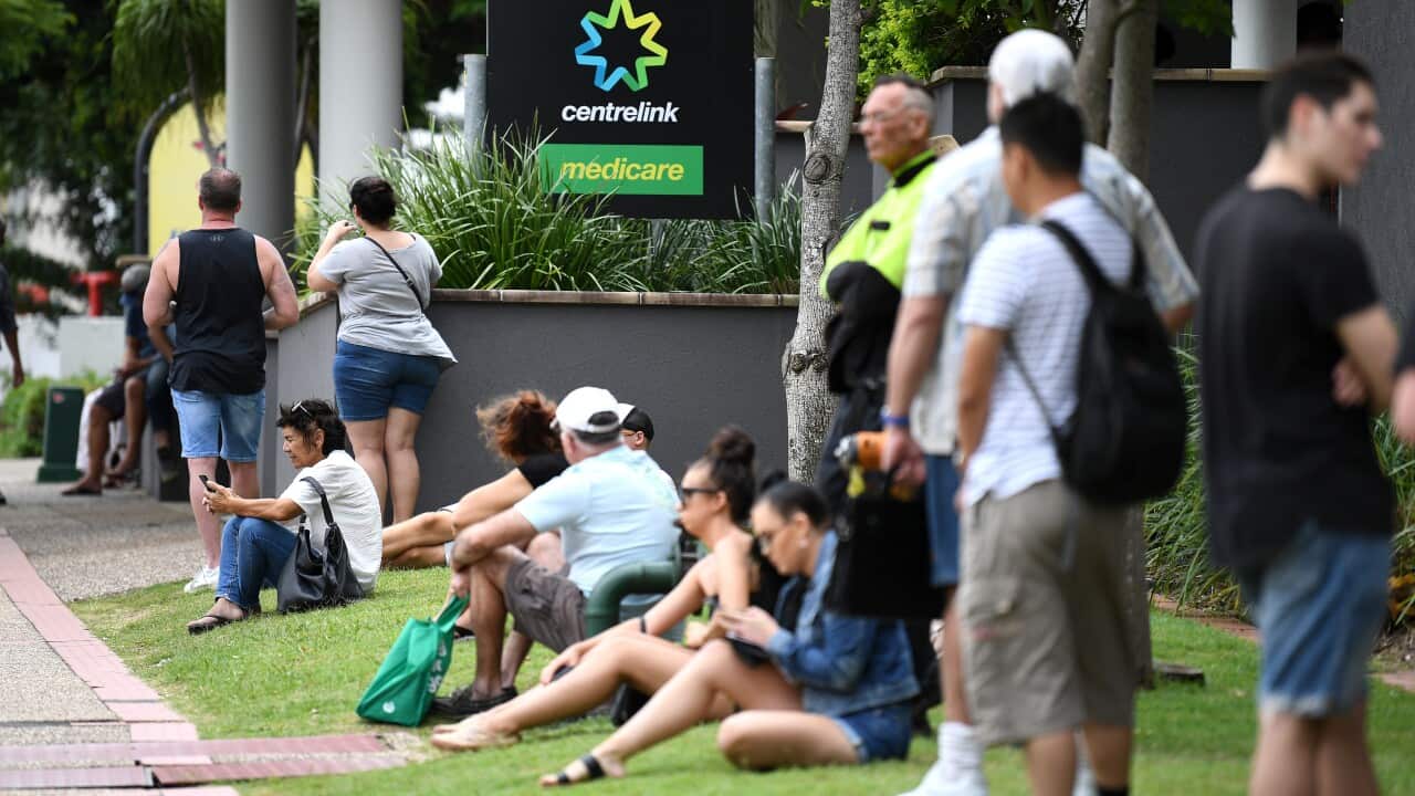 People in long queues outside the Centrelink