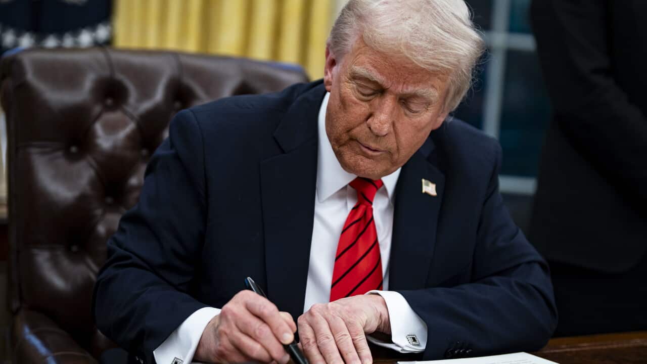 US President Trump signs executive order in Oval Office