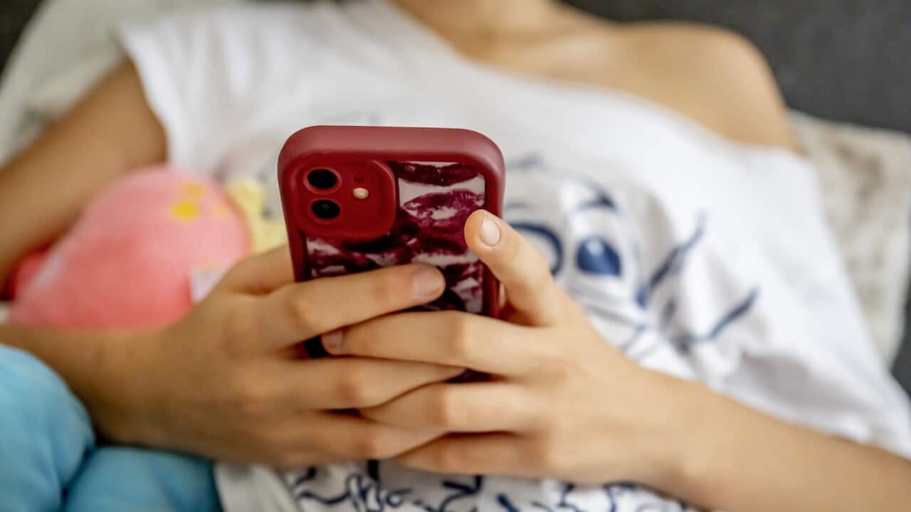 A teenage girl on her cell phone