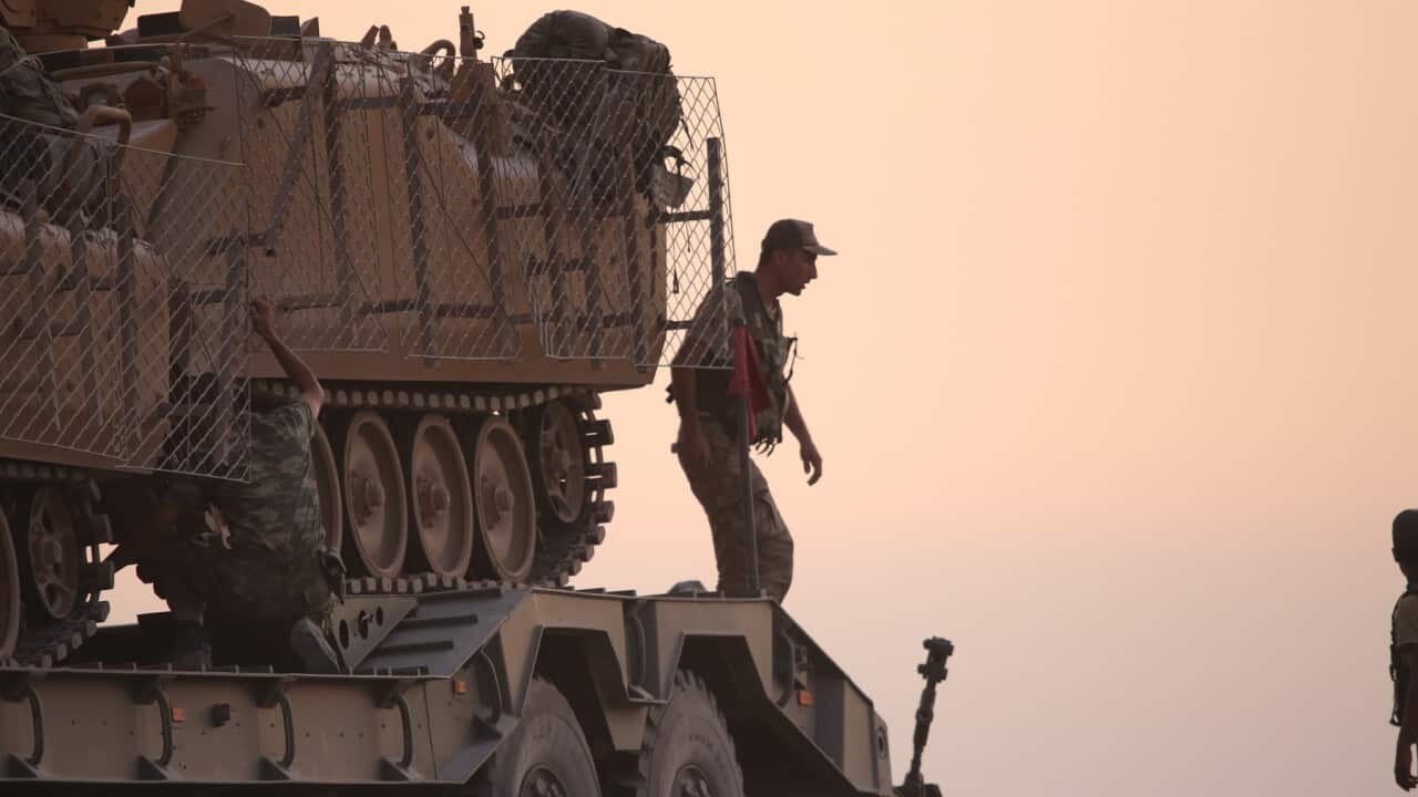 Turkish soldiers with armored vehicles and tanks
