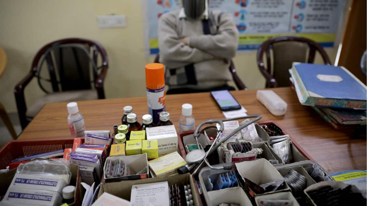 A doctor waits at an Indian vaccination room (AAP).jpg