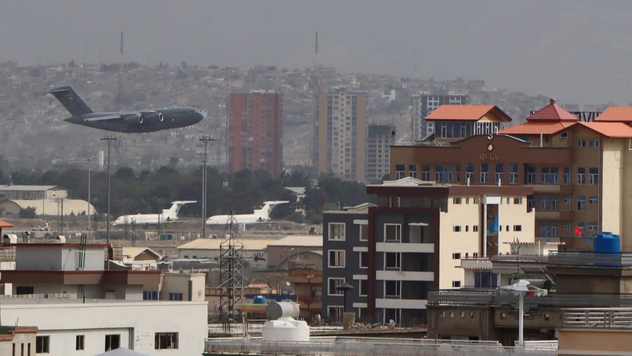 A military aircraft takes off at the Hamid Karzai International Airport in Kabul