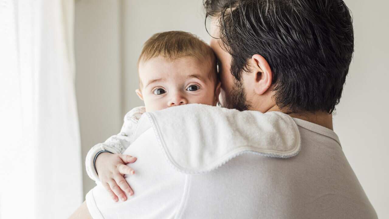 Father burping his baby