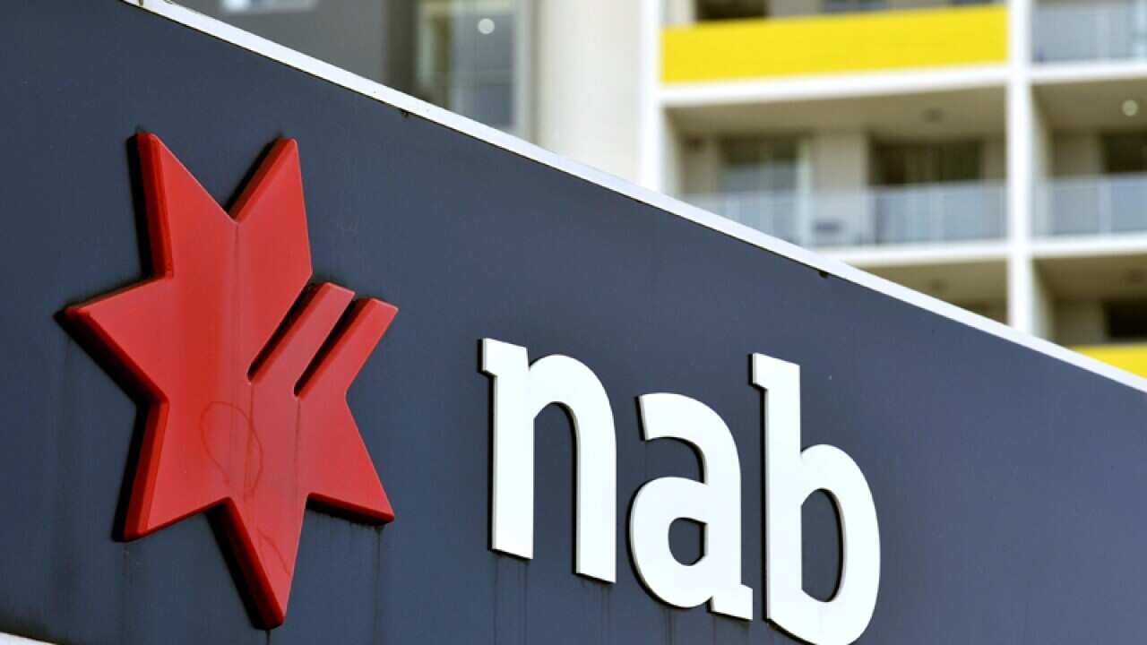 Residential apartment housing seen behind NAB bank signage
