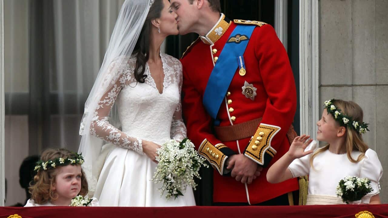 Their Royal Highnesses Prince William, Duke of Cambridge and Catherine, Duchess of Cambridge kiss on the balcony at Buckingham Palace. (Getty Images)