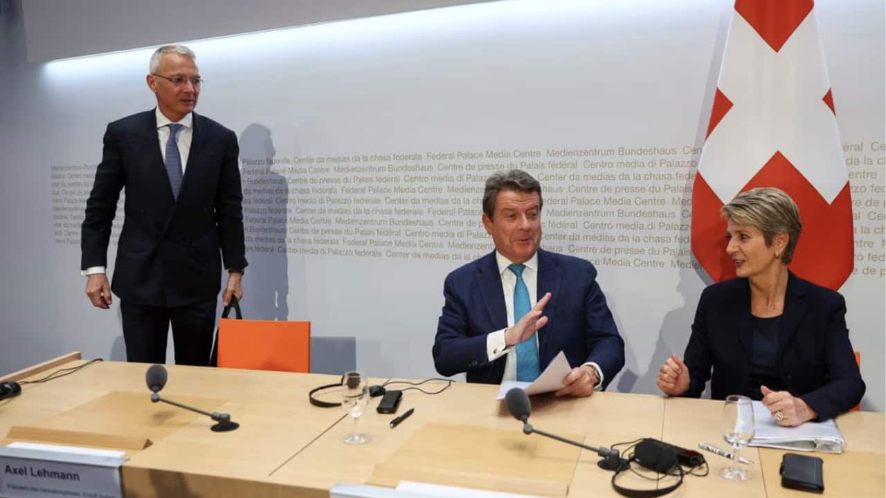 Chairman of the Board of Directors of Credit Suisse, Axel Lehmann, Chairman of the Board of Directors of UBS, Colm Kelleher and Federal Councillor and chief of the finance federal department Karin Keller-Sutter attend a news conference on Credit Suisse after UBS takeover offer, in Bern, Switzerland, March 19, 2023. REUTERS/Denis Balibouse