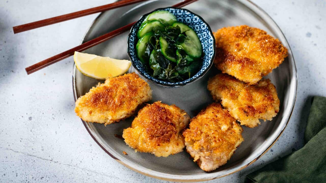 Salt and pepper crumbed chicken with cucumber and wakame salad