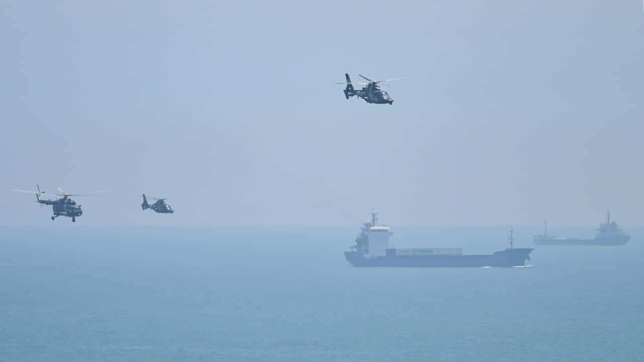 Chinese military helicopters fly past Pingtan Island in Fujian province, ahead of massive military drills off Taiwan.