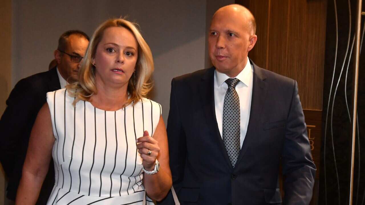 Minister for Home Affairs Peter Dutton and wife Kirilly Dutton arrive at the National Press Club in Canberra, Wednesday, February 21, 2018. 