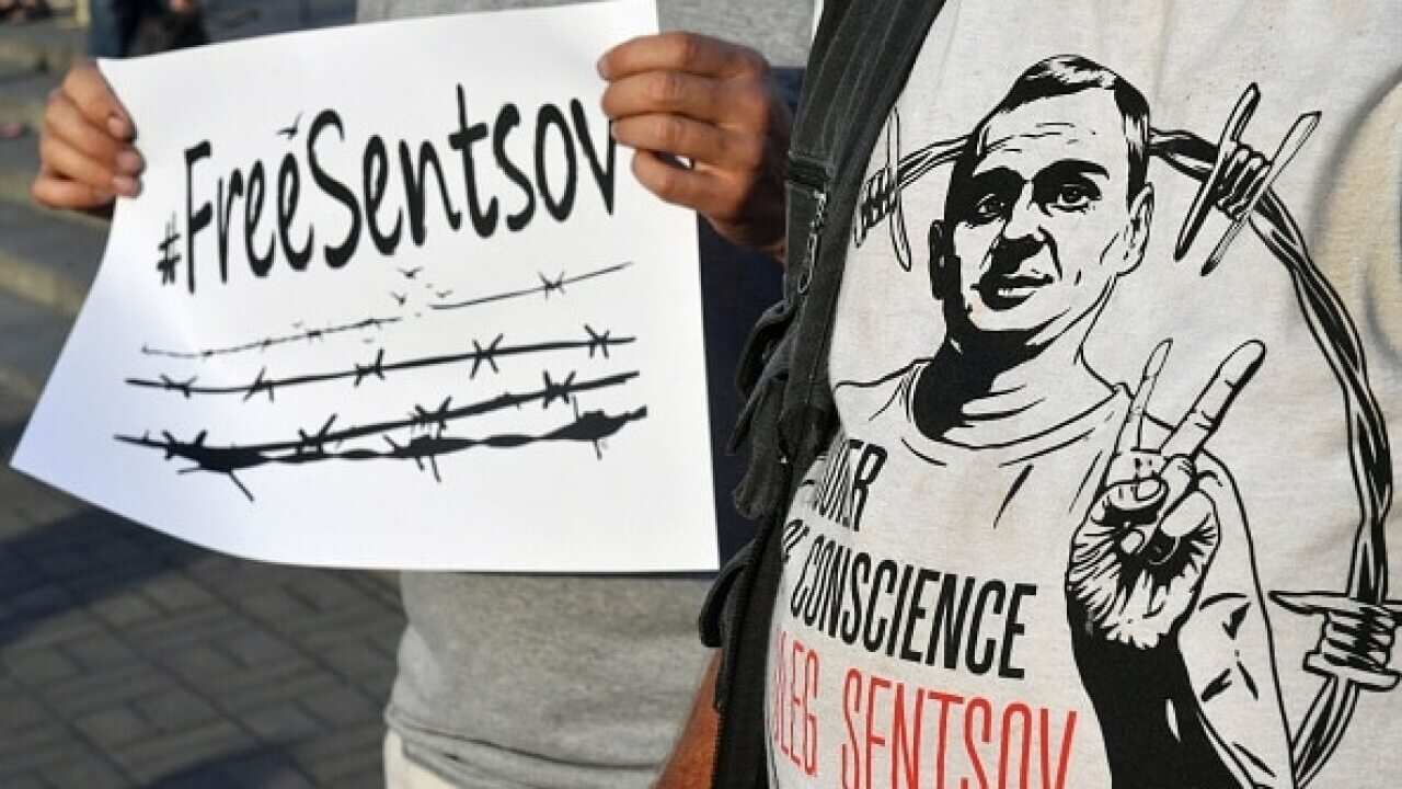 People attend a rally at Independence Square in Ukrainian capital of Kiev marking Oleg Sentsov birthday on July 13, 2018.