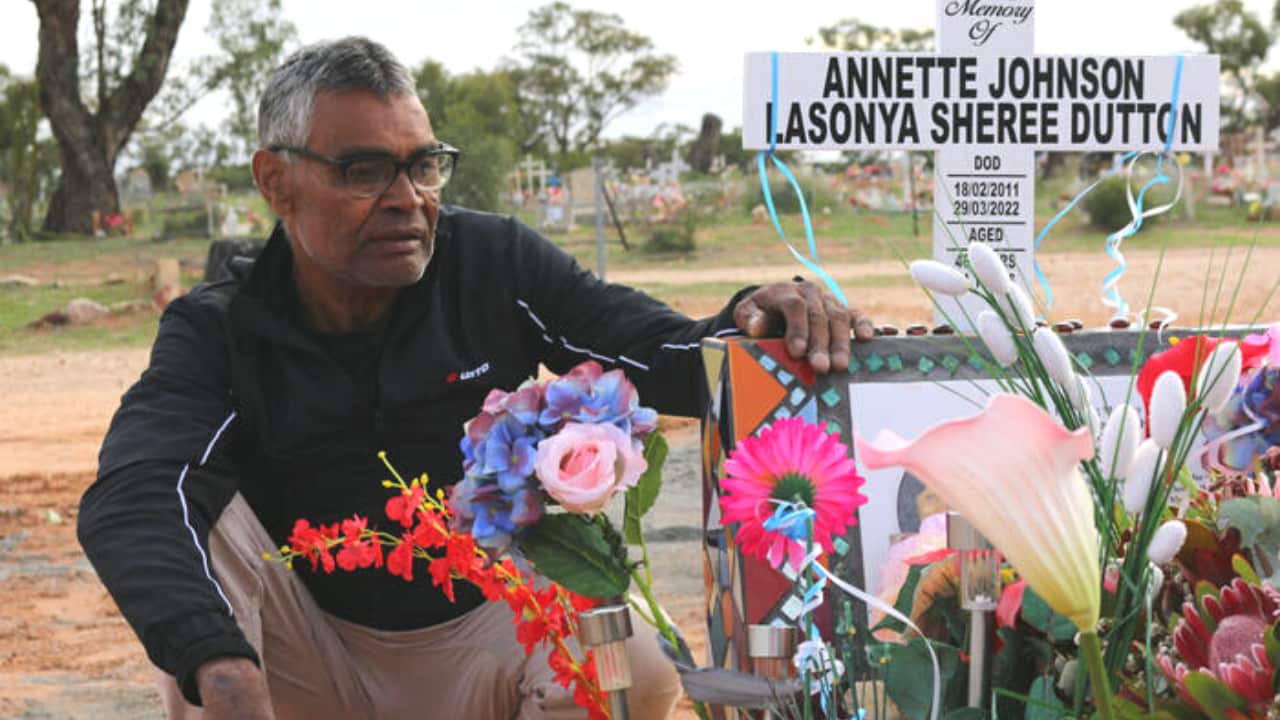 Keith dutton sits by the flower-adorned graveside of his daughter Lasonya