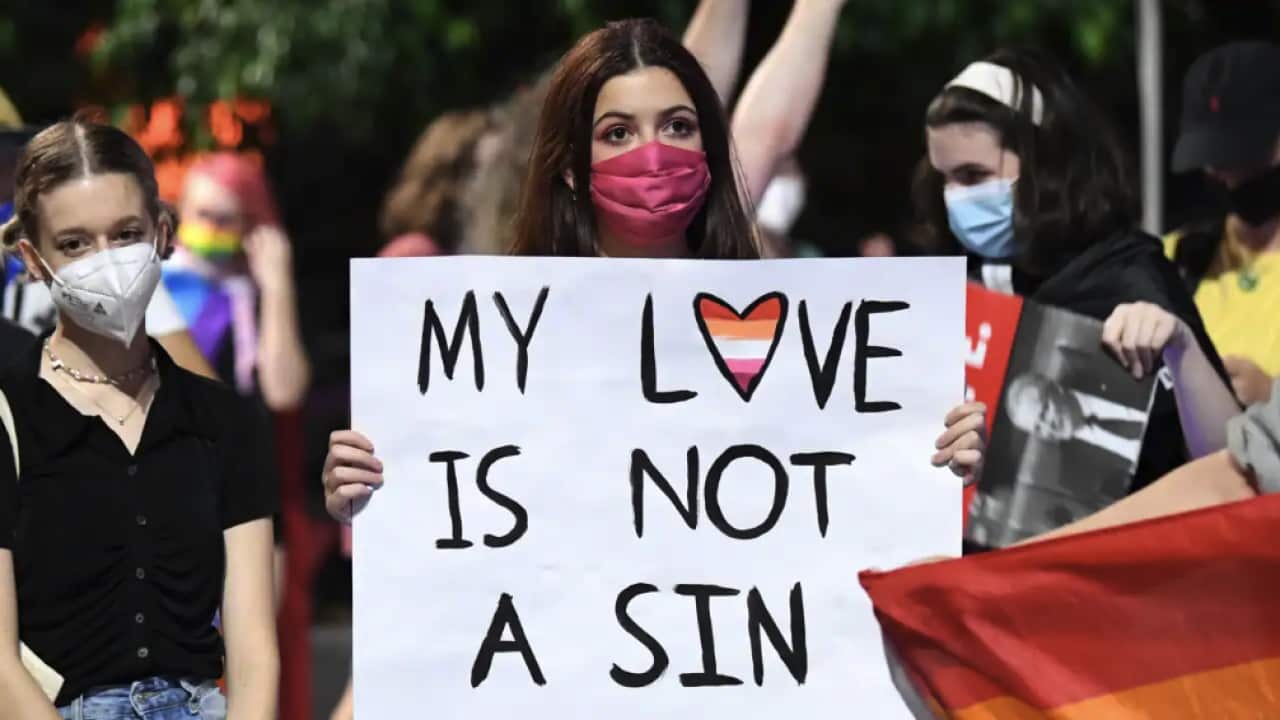 Supporters and members of the LGBTIQ+ community protest Citipointe Christian College at a rally in King George Square in Brisbane.