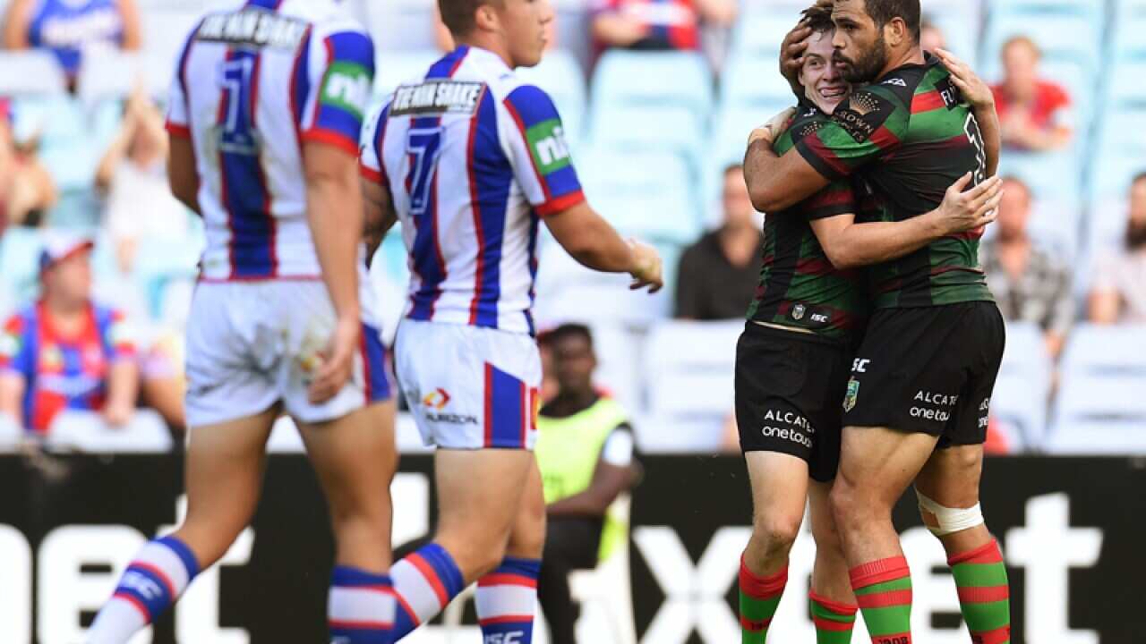 The Rabbitohs Greg Inglis celebrates with Luke Keary.