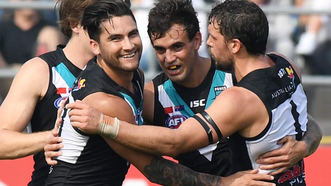 Brendon Ah Chee of the Power (C) celebrates a goal