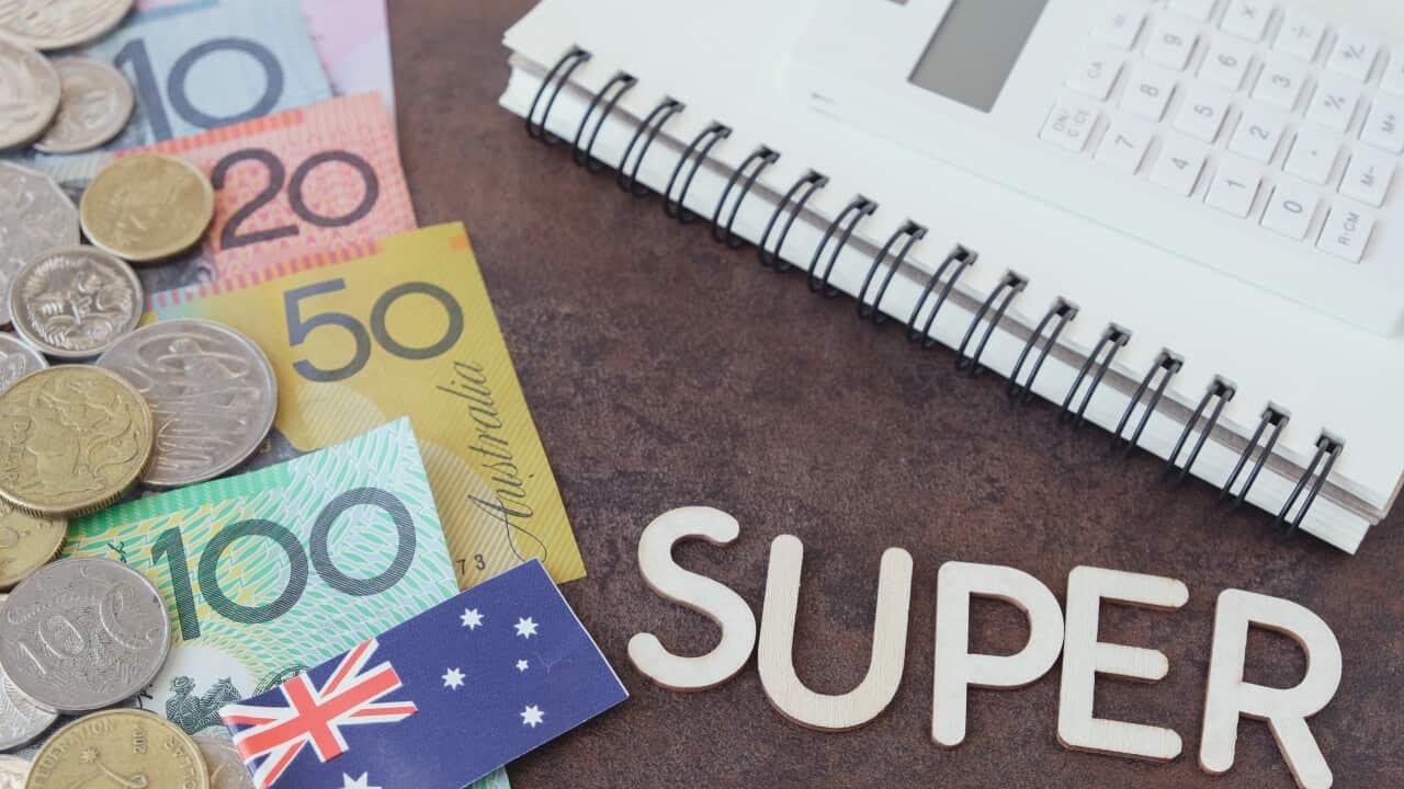 Australian notes and coins, a calculator, a notebook, and the word 'SUPER.'