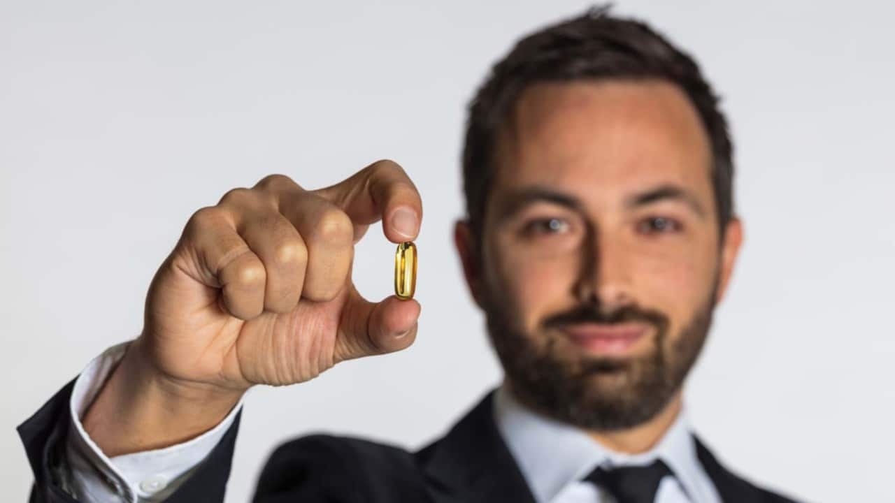 Almost one billion of us take a regular dietary supplement, mainly vitamin tablets. (Pictured: Dr Derek Muller, host of Vitamania.)