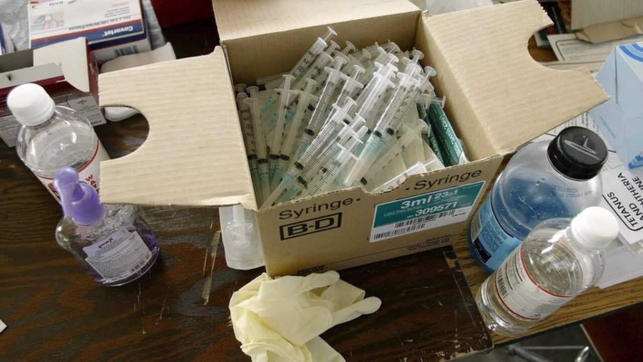 Boxes of syringes from hepatitis shots (AAP)