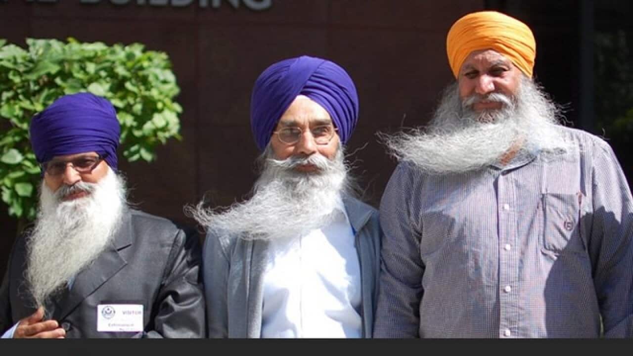 Four Sikhs have won a landmark settlement