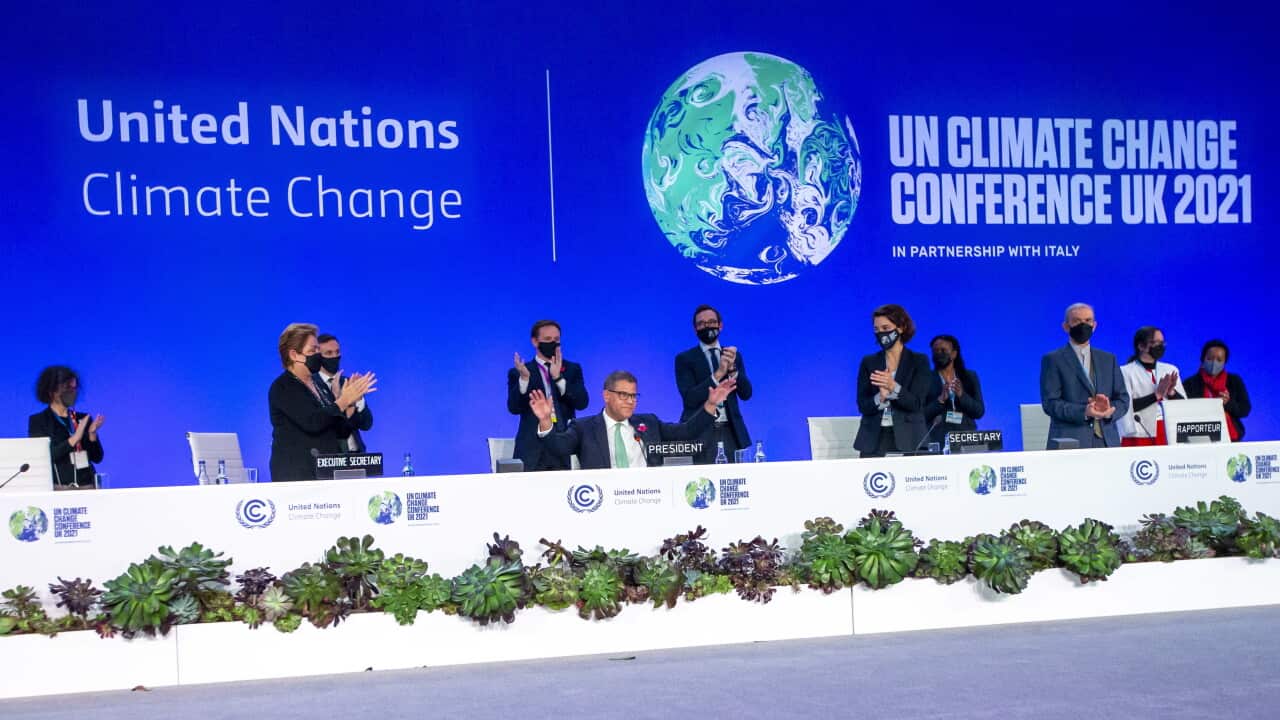 Alok Sharma (C), President COP26 receives a standing ovation during the Plenary session of the COP26 UN Climate Change Conference in Glasgow, Britain, 13 November 2021.