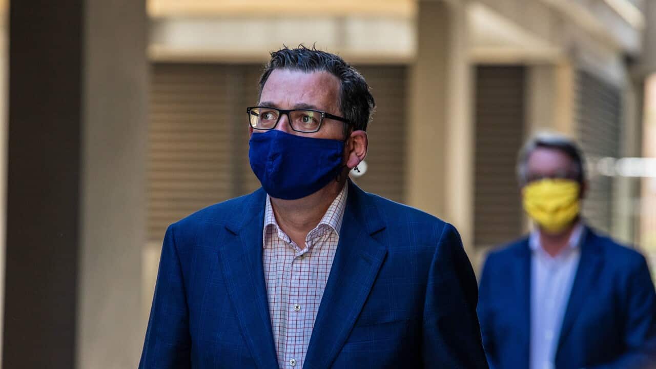 Premier Daniel Andrews and the Minister fro the Health of Victoria Martin Foley arrive at Parliament House to attend a press conference.