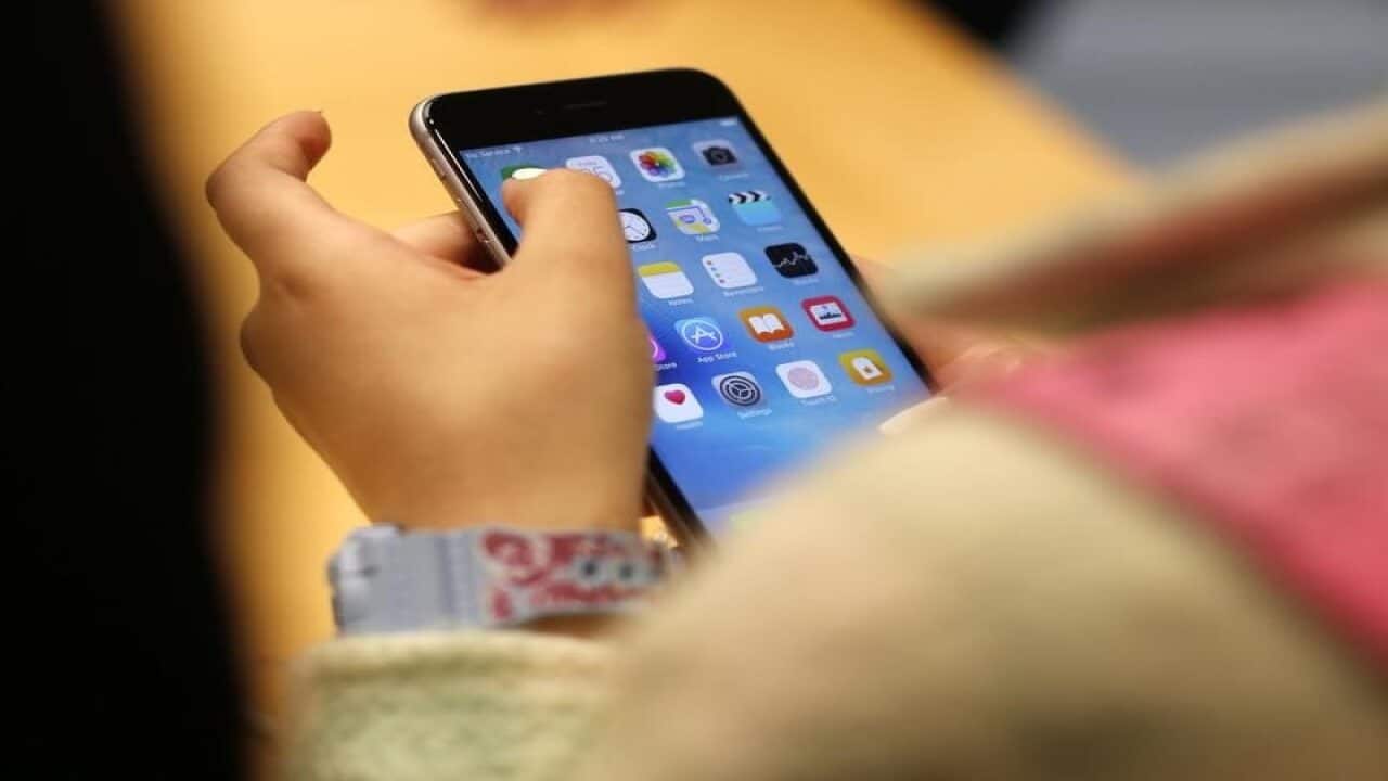 Women holding mobile phone